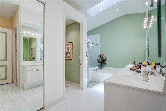 bathroom with independent shower and bath, vanity, tile patterned floors, and vaulted ceiling with skylight