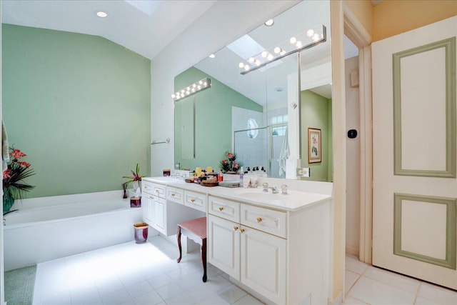 bathroom featuring double vanity, lofted ceiling, tile patterned floors, and a washtub