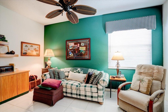 tiled living room with a wealth of natural light and ceiling fan