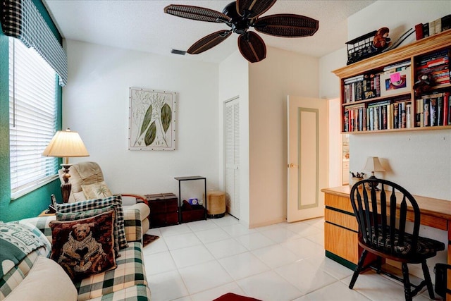 interior space featuring ceiling fan