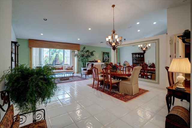 tiled dining space featuring a notable chandelier