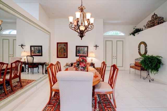 dining space with an inviting chandelier and light tile patterned floors