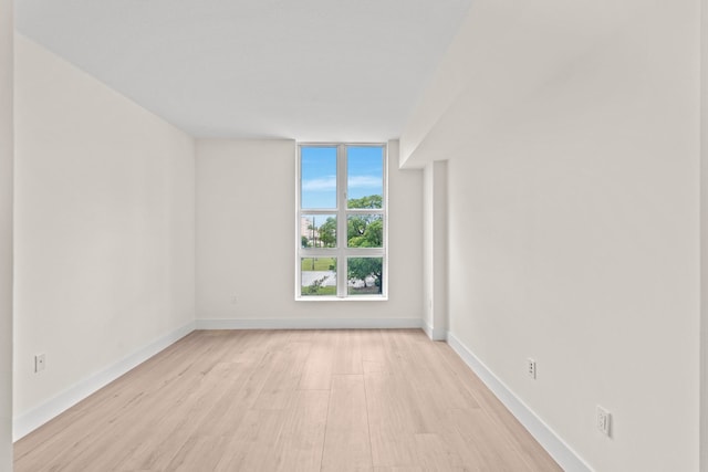 empty room with light wood-type flooring