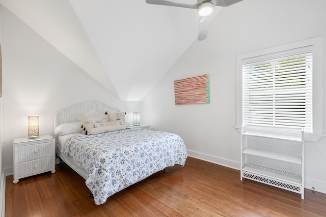 bedroom with ceiling fan, lofted ceiling, and wood-type flooring