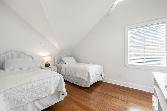 bedroom featuring vaulted ceiling and hardwood / wood-style floors