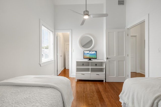 bedroom with ceiling fan and hardwood / wood-style flooring