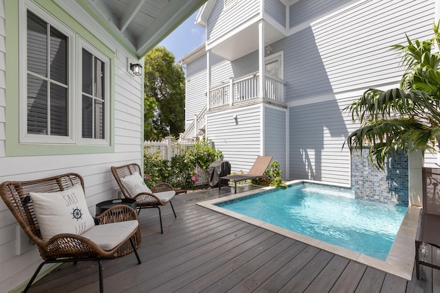 view of pool with a wooden deck