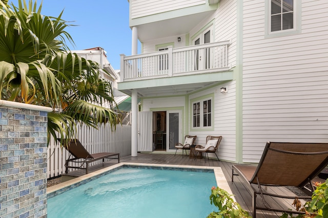 view of swimming pool featuring a wooden deck