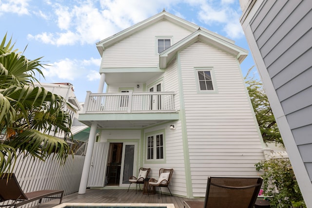 rear view of house featuring a balcony