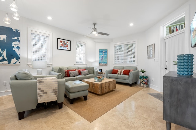 living room with ceiling fan and light tile patterned floors