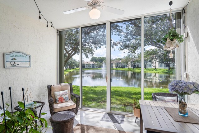 7869 Laina Ln Unit 2, Boynton Beach, FL 33437 - sunroom with a water view, a ceiling fan, and plenty of natural light