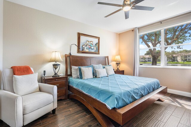 7869 Laina Ln Unit 2, Boynton Beach, FL 33437 - bedroom with baseboards, wood finished floors, and a ceiling fan