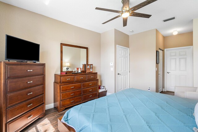 7869 Laina Ln Unit 2, Boynton Beach, FL 33437 - bedroom featuring wood finished floors, ceiling fan, and baseboards