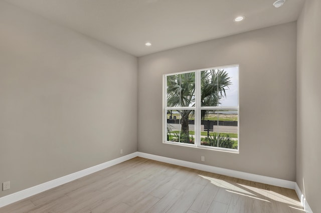 unfurnished room featuring light hardwood / wood-style floors