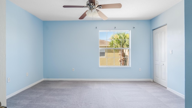 2156 SE Eatonville Dr, Port Saint Lucie, FL 34952 - carpeted spare room with baseboards and a ceiling fan