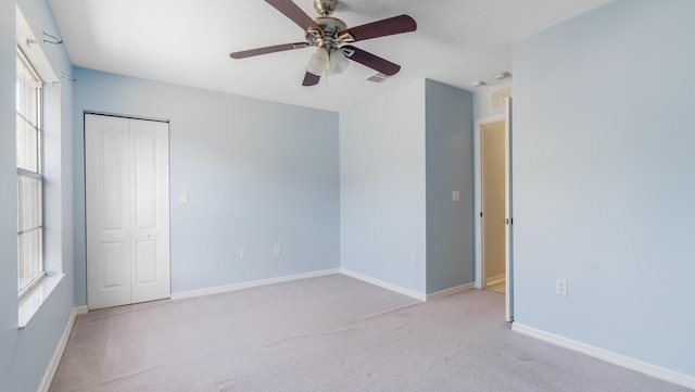 2156 SE Eatonville Dr, Port Saint Lucie, FL 34952 - empty room with carpet flooring, visible vents, baseboards, and ceiling fan