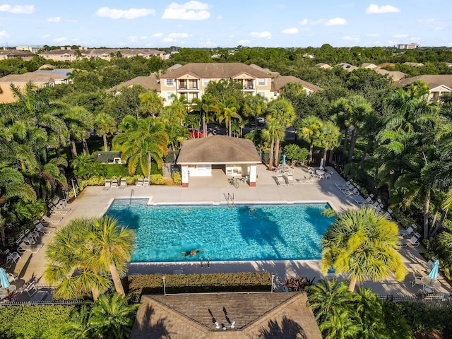2156 SE Eatonville Dr, Port Saint Lucie, FL 34952 - community pool featuring a residential view, fence, and a patio