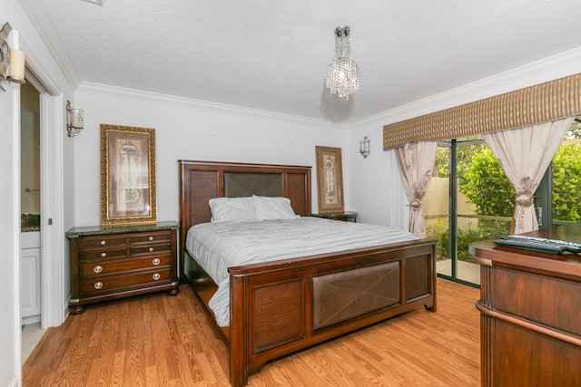 bedroom with access to outside, a textured ceiling, light wood-type flooring, and ornamental molding