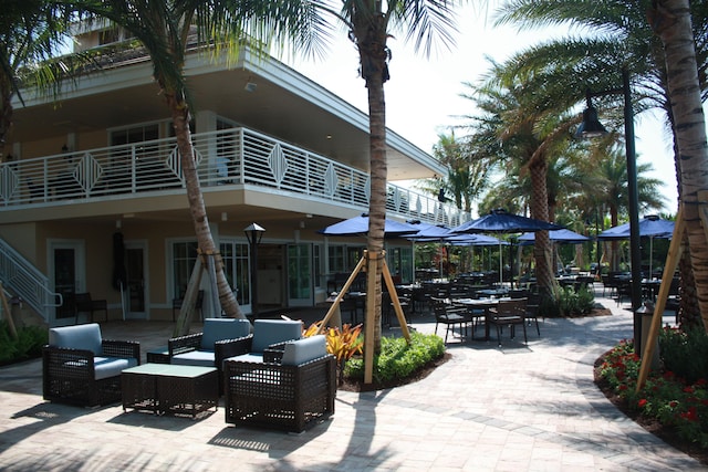 view of patio featuring a balcony