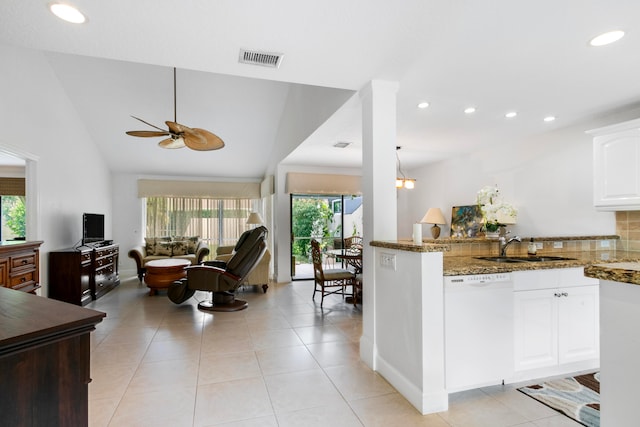 kitchen featuring dishwasher, white cabinetry, stone counters, plenty of natural light, and ceiling fan