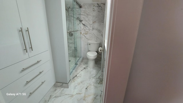 bathroom with an enclosed shower and toilet