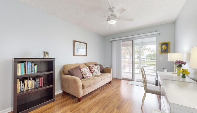 office with ceiling fan, a textured ceiling, and light hardwood / wood-style flooring