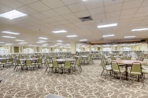 dining area with a paneled ceiling