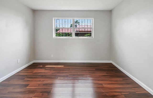 spare room with hardwood / wood-style floors