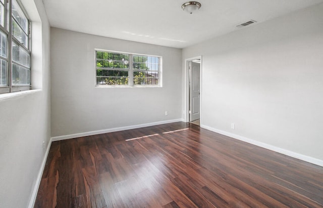 spare room with wood-type flooring