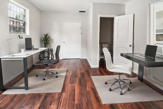 office space featuring dark wood-type flooring