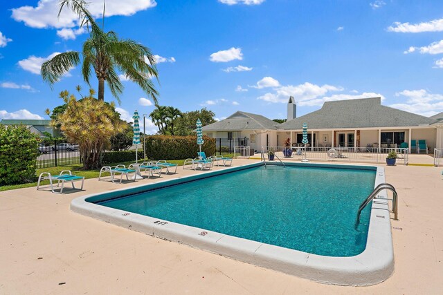 view of swimming pool with a patio