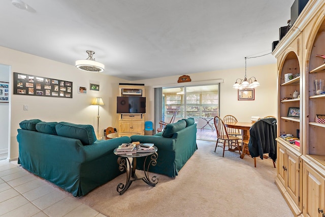 living room with light tile patterned flooring and a notable chandelier