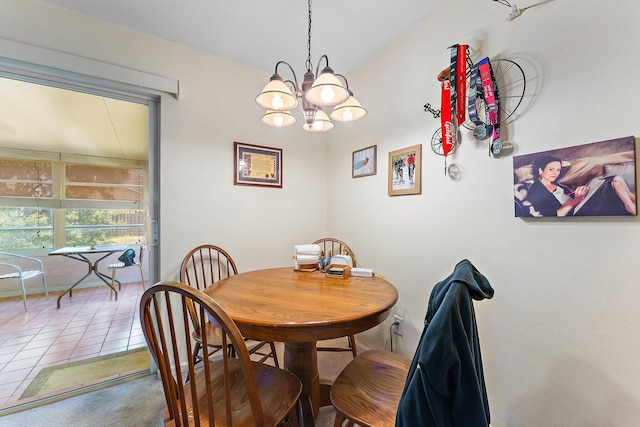 tiled dining room featuring a chandelier