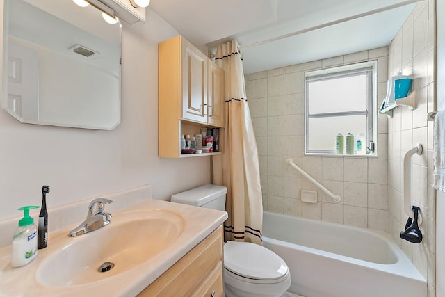 full bathroom featuring shower / bath combination with curtain, toilet, and vanity