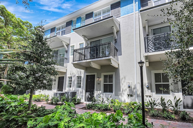 exterior space with a balcony and central AC