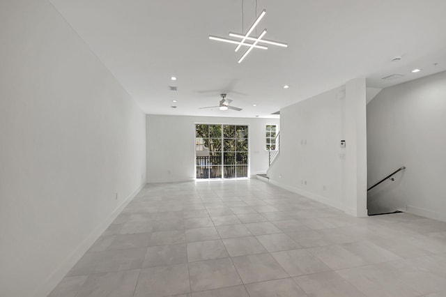 tiled empty room with ceiling fan