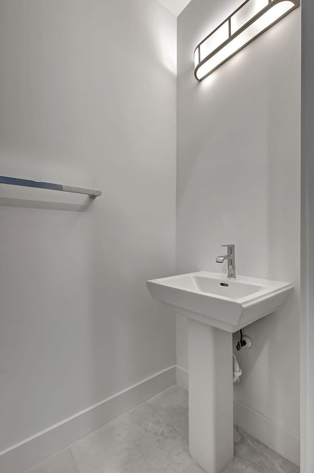 bathroom with tile patterned flooring and sink