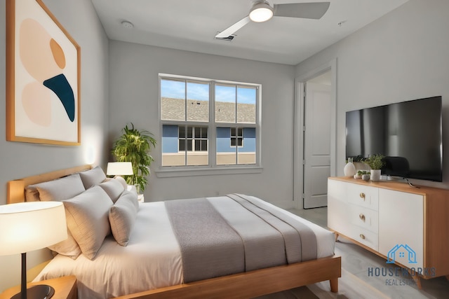 bedroom with light hardwood / wood-style flooring and ceiling fan