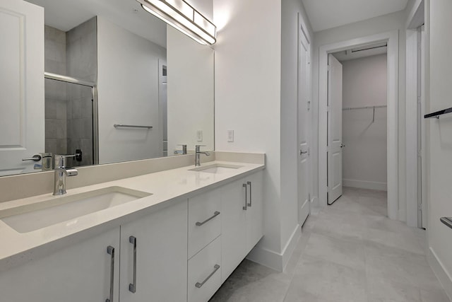 bathroom with dual vanity and tile patterned floors