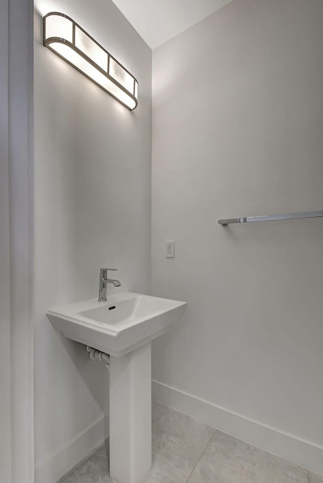 bathroom with tile patterned floors