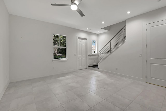 entryway with ceiling fan and light tile patterned floors