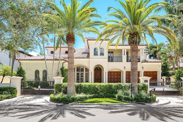 mediterranean / spanish home with a balcony