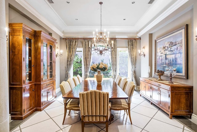 tiled dining area with a notable chandelier, a tray ceiling, and crown molding