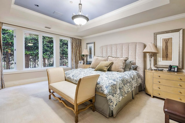 carpeted bedroom with a raised ceiling and crown molding