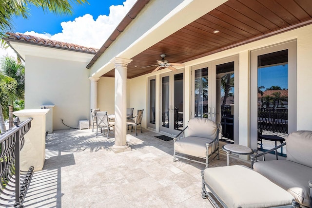 view of patio / terrace featuring french doors and ceiling fan