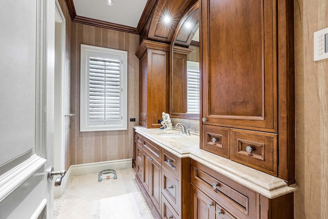 bathroom with tile patterned floors, crown molding, and vanity