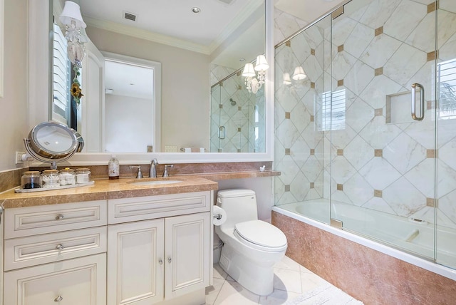 full bathroom with vanity, enclosed tub / shower combo, crown molding, tile patterned flooring, and toilet