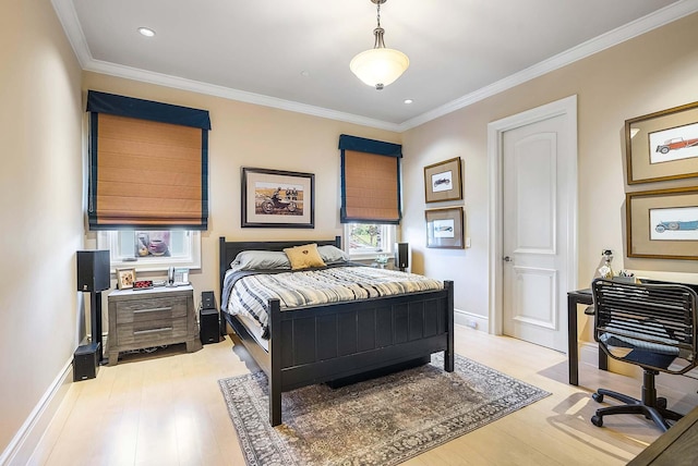 bedroom with light hardwood / wood-style flooring and crown molding