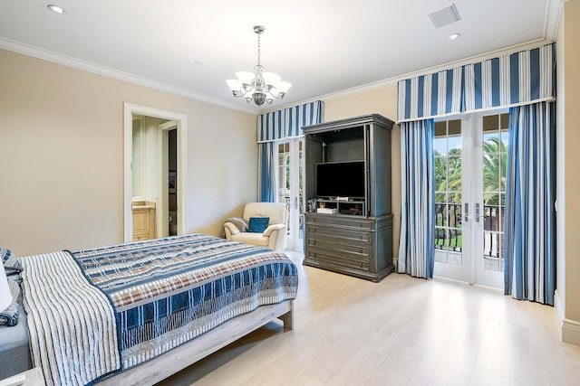 bedroom with wood-type flooring, connected bathroom, an inviting chandelier, ornamental molding, and access to exterior