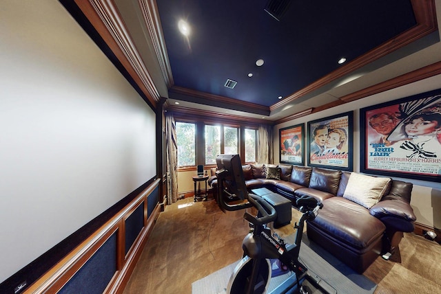 home theater with crown molding and a tray ceiling